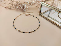 bracelet acier inoxydable doré et perles noir Sophie Bijoux